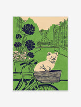 Illustrative dog art print featuring a fluffy dog in a bicycle basket, with a green city canal and buildings in the background.