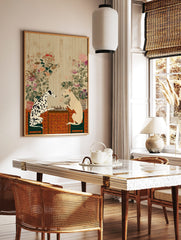 Dalmatian and sighthound dogs playing chess on a table with a patterned cloth and botanical wall art, in a styled room mockup
