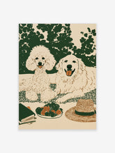 Illustrated wall art of a poodle and golden retriever on a picnic blanket with strawberries, a hat, and a book