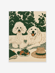 Illustrated wall art of a poodle and golden retriever on a picnic blanket with strawberries, a hat, and a book