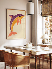 Stylised dolphin illustration in purple, orange, and coral on a neutral background, illustrative, in a styled room mockup