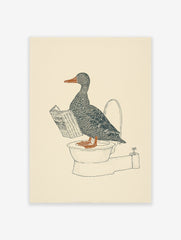 Duck wall art illustration of a gray duck with an orange beak and feet reading a newspaper while sitting on a toilet.