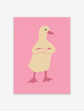 Illustrated duck wall art with crossed arms on a pink background, featuring a pale yellow duck with a reddish-pink beak.