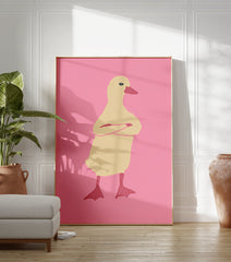 Illustrated duck wall art with crossed arms on a pink background, featuring a pale yellow duck with a reddish-pink beak. - Image 3