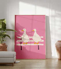 Illustrated pink duck wall art featuring two white ducks with yellow beaks and feet sitting on a bench against a pink background. - Image 3