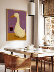 Illustrative art print of a white duck standing next to a glass of red wine against a solid purple, in a styled room mockup