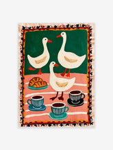 Folk art print of three white ducks, croissants, and coffee cups on green and pink striped background