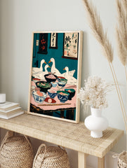 Illustrative print of four white ducks dining at a table filled with food bowls, teal, in an alternate framed mockup
