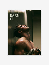 Earn It gym poster with wet male figure in dark shower and bold white typography