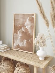 Close-up of voluminous sepia-toned cumulus clouds in a dynamic sky, captured in a, in an alternate framed mockup