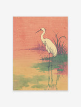 Egret Wall Art print featuring a white egret standing in a serene pond with lily pads under a warm, star-speckled orange sky, Ukiyo-e style.