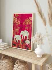 Illustrative print of a white elephant family and botanical plants on a vibrant hot pink, in an alternate framed mockup