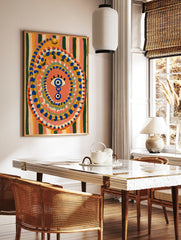 Evil eye wall art with blue and yellow concentric dots on a striped background, illustrative, in a styled room mockup