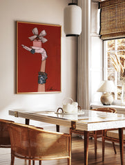 Fashion illustration of a gloved hand holding a pink perfume bottle with blue jewel ring and, in a styled room mockup