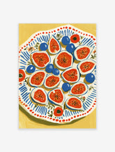 Fig and blueberry art print with halved red figs and blue fruit on a blue-striped plate against a yellow background