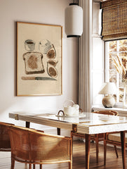 Illustrative breakfast art print featuring a slice of fig toast, fresh figs, and condiments on, in a styled room mockup
