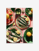 Illustrative fish art print with fresh seafood, lemon slices, grapefruit, and green leaves on a pink striped tablecloth.