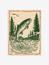Vintage fish wall art print showing a green fish jumping out of water with pine trees and birds under an orange border.