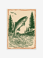 Vintage fish wall art print showing a green fish jumping out of water with pine trees and birds under an orange border.