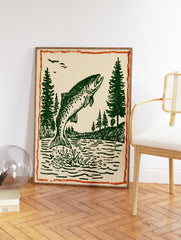 Vintage fish wall art print showing a green fish jumping out of water with pine trees and birds under an orange border. - Image 2