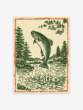 Woodcut style illustration of a jumping trout fish in a lake with pine trees and mountains, framed by an orange border.