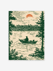 Illustrative print of a fisherman in a boat on a lake, framed by pine trees, under a setting sun