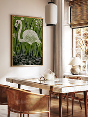 White flamingo in linocut style, standing in water among green reeds and white flowers, in a styled room mockup