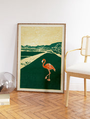 Flamingo walking on a path in a tropical landscape art print with green, gold, and orange colors in a block print style. - Image 2