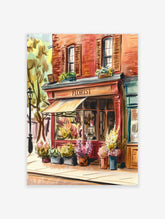 Watercolor florist shop poster on a city street with an orange awning, red brick building, and colorful flowers displayed outside.