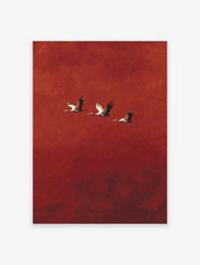 Three cranes with outstretched wings flying diagonally against a textured red background