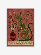 Folk art cat wall art with Indian-inspired floral patterns in green and red against a textured background.