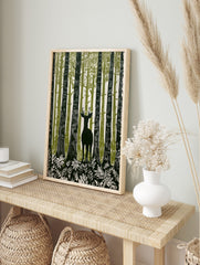 Illustrative forest deer wall art with a stag among tall green and white trees and foliage, in an alternate framed mockup