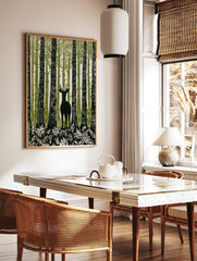 Illustrative forest deer wall art with a stag among tall green and white trees and foliage, in a styled room mockup