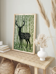 Illustrative green and white print of a forest stag with ornate body patterns amidst tall, in an alternate framed mockup