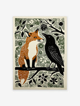 Woodcut style illustration print of an orange fox and a black crow sitting on a branch amidst green foliage.