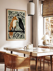 Woodcut style illustration print of an orange fox and a black crow sitting on a branch amidst green foliage. - Image 3