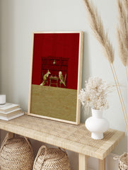 Illustrative print of a fox and an owl playing chess at a table, against a red bookshelf, in an alternate framed mockup
