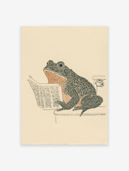 Humorous frog art print showing a frog sitting on a toilet reading a newspaper, in black, orange, and beige tones.