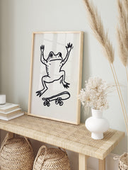 Black and white whimsical frog art print on a skateboard illustration on a plain background. - Image 3