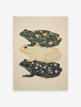 Decorative frog art print featuring three stacked frogs with botanical patterns and white dots on a light beige background.