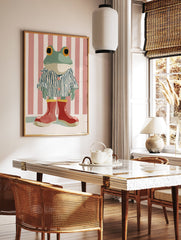 Whimsical frog art print in blue striped pajamas and red boots against a pink and white striped background. - Image 2