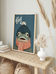 Whimsical frog art print featuring a frog wearing a blue beanie and orange scarf on a teal background with Chinese character. - Image 3