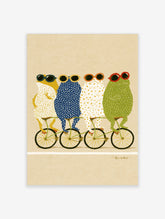Four spotted frogs wearing sunglasses ride a green tandem bicycle on a beige background