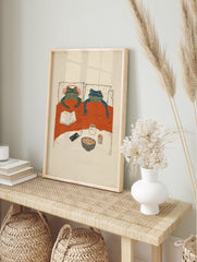 Whimsical frog wall art illustration of two frogs in bed with popcorn, a book, and headphones for a cozy night in. - Image 3