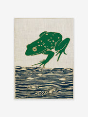 Green frog leaping over blue water on a woven tapestry with gold outlines