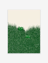 Illustrated frog wall art with two green frogs peeking out of tall green grass on an off-white background.