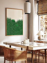Illustrated frog wall art with two green frogs peeking out of tall green grass on an off-white background. - Image 2