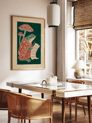 Illustrative frog in a red robe writing on a scroll next to red mushrooms against a dark green background, folk art print. - Image 3