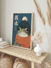 Japanese style frog wall art illustration of a frog wearing a blue beanie and orange scarf on a textured blue background. - Image 3