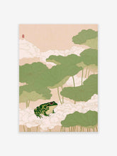 Japanese frog wall art print with a green frog on white clouds surrounded by large green lotus leaves on a light pink background.